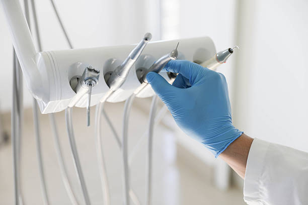Professional Tooth Extraction technician working in Dallas, TX